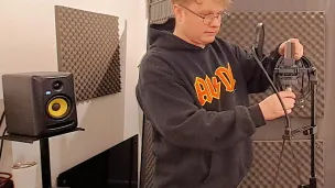 Person plugging in a microphone